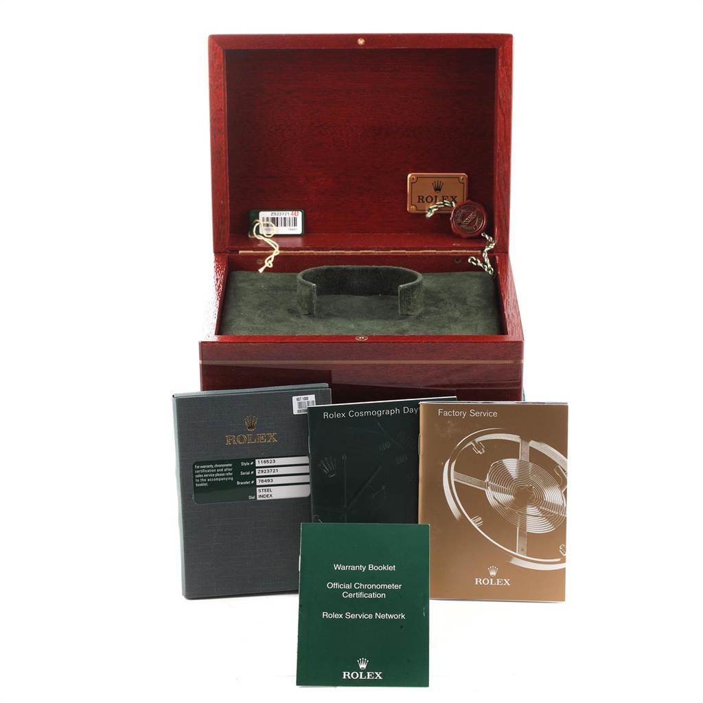 The image shows a Rolex Daytona 116523 Men's Steel and Gold (two tone) Grey Dial 116523 Men's Steel and Gold (two tone) Grey Dial watch box with warranty, certification booklets, and a service manual in front.