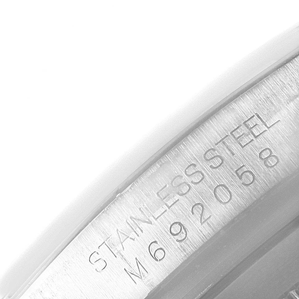 This image shows a detailed view of the stainless steel casing with the serial number of a Rolex Daytona 116520 Men's Stainless Steel Black Dial 116520 Men's Stainless Steel Black Dial watch.