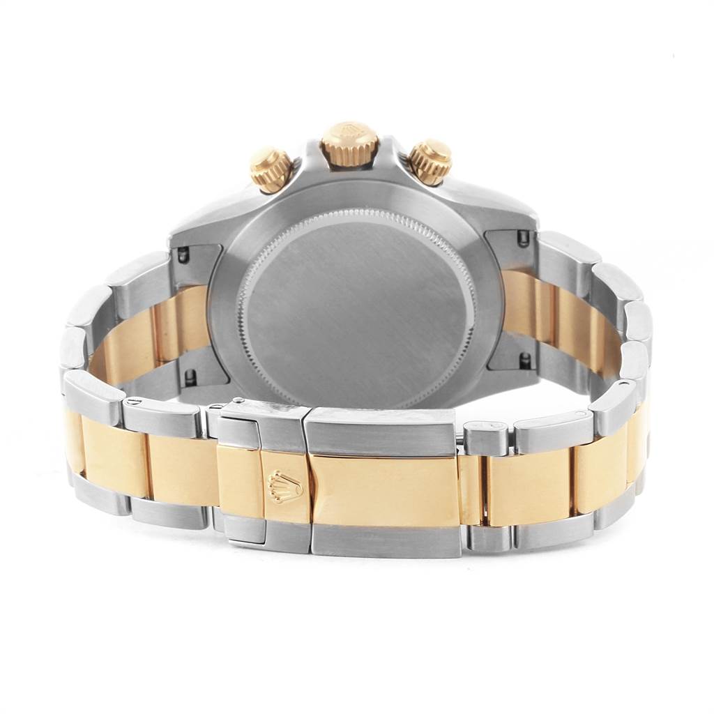 This image shows the rear view of a Rolex Daytona 116523 Men's Steel and Gold (two tone) Blue Dial 116523 Men's Steel and Gold (two tone) Blue Dial watch, highlighting its case, bracelet, and clasp.