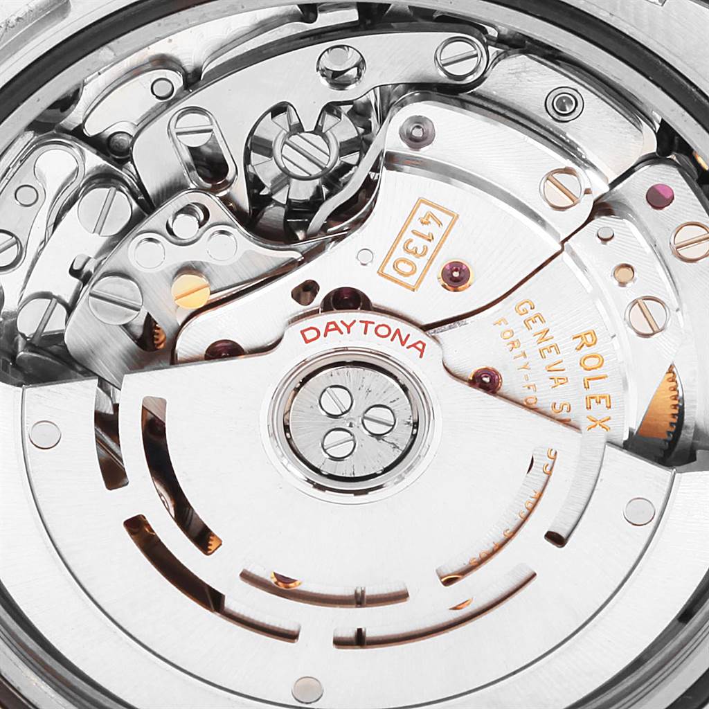 This image shows a close-up of the movement mechanism inside a Rolex Daytona 116523 Men's Steel and Gold (two tone) Blue Dial 116523 Men's Steel and Gold (two tone) Blue Dial watch, highlighting components and engravings.