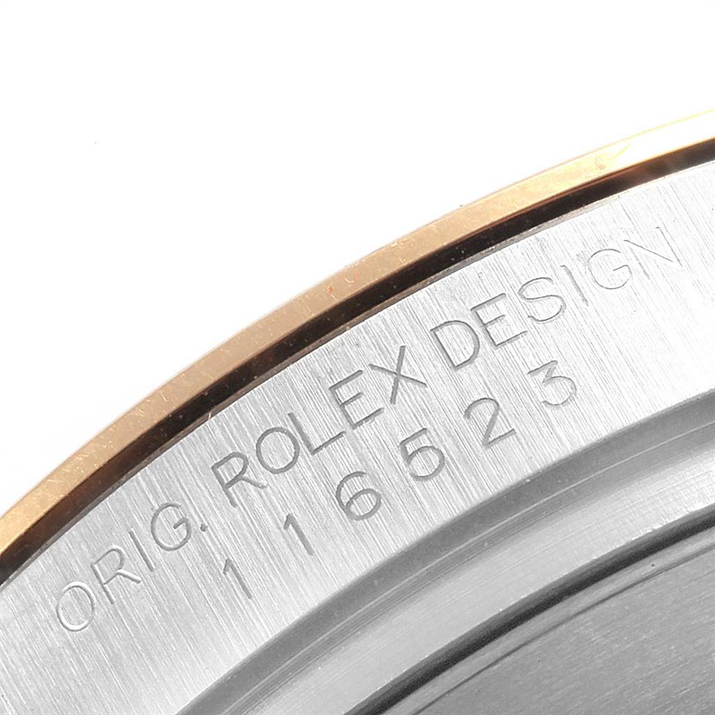 The image shows a close-up of the engraved case back of a Rolex Daytona 116523 Men's Steel and Gold (two tone) Blue Dial 116523 Men's Steel and Gold (two tone) Blue Dial watch, displaying the model number 116523.