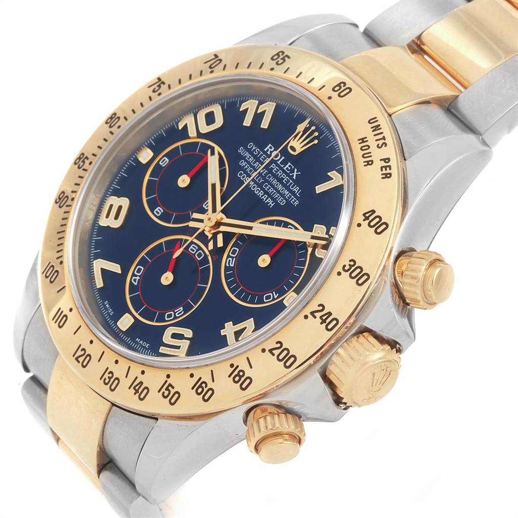 The image shows a close-up angled view of a Rolex Daytona 116523 Men's Steel and Gold (two tone) Blue Dial 116523 Men's Steel and Gold (two tone) Blue Dial watch, highlighting its two-tone bezel, dial, and crown.