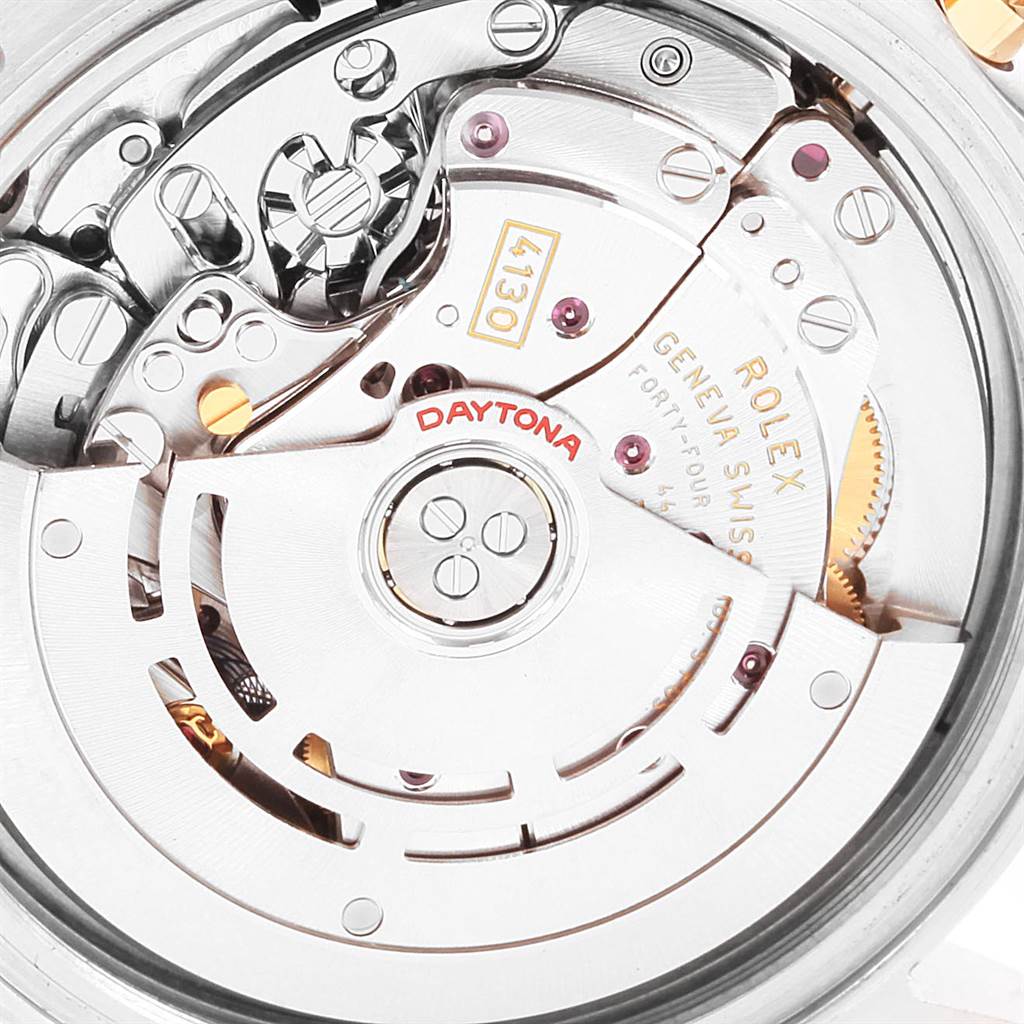 This close-up image shows the intricate movement mechanism of the Rolex Daytona 116523 Men's Steel and Gold (two tone) White Dial 116523 Men's Steel and Gold (two tone) White Dial watch model, featuring the self-winding rotor.
