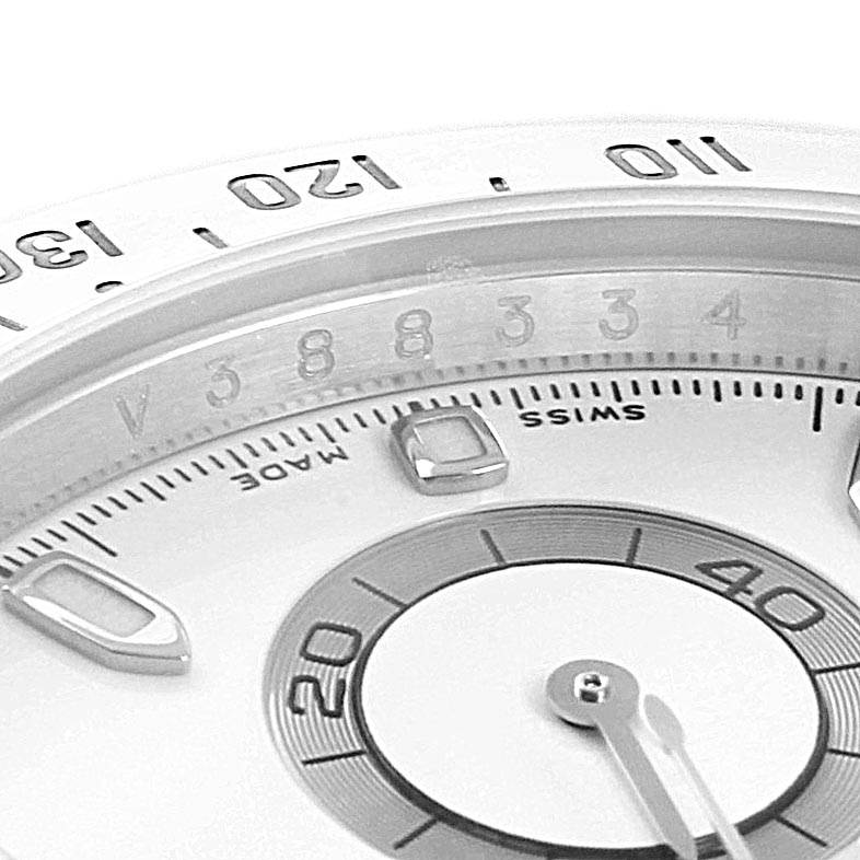 This close-up image shows the dial, bezel, and partially visible subdial of a Rolex Daytona 116520 Men's Stainless Steel White Dial 116520 Men's Stainless Steel White Dial watch.