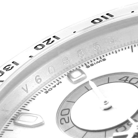This close-up image shows the bezel and part of the dial of a Rolex Daytona 116520 Men's Stainless Steel White Dial 116520 Men's Stainless Steel White Dial watch.