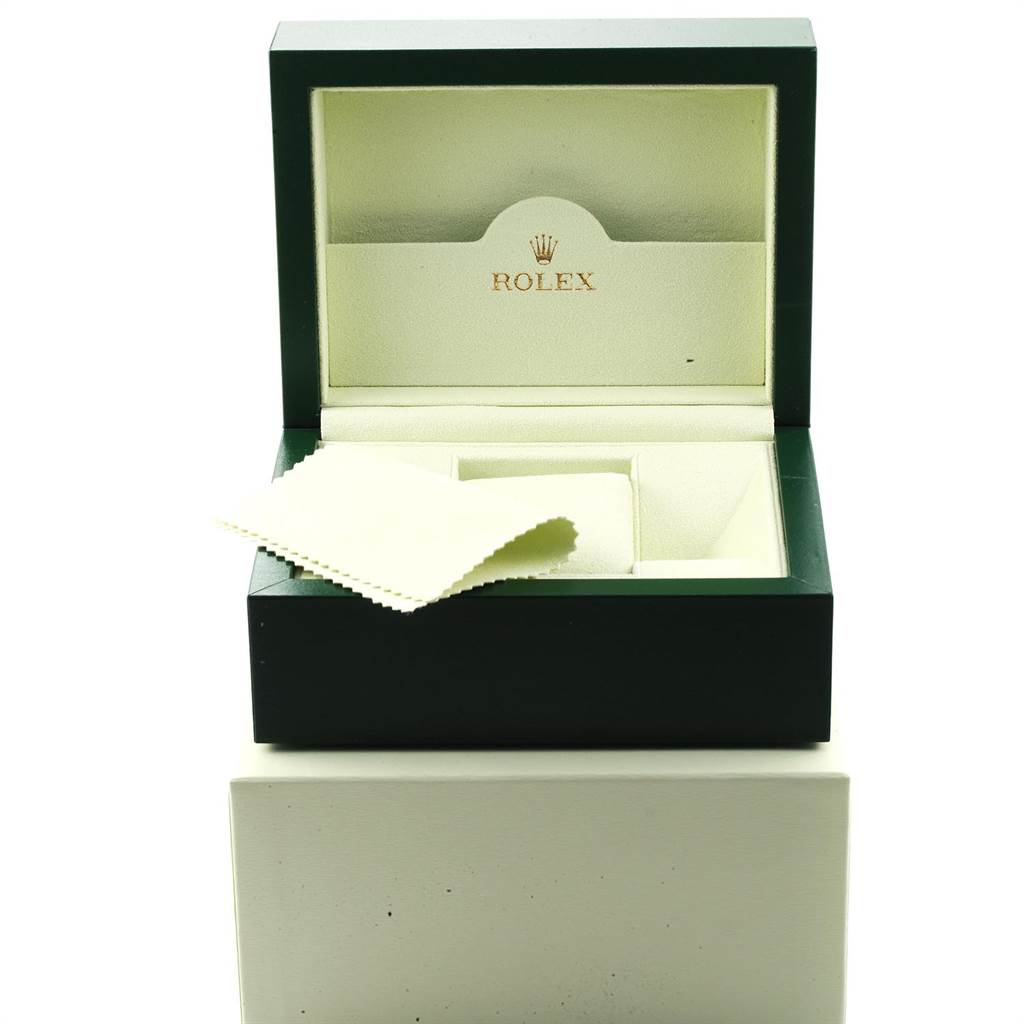 The image shows an open Rolex Daytona 116520 Men's Stainless Steel White Dial 116520 Men's Stainless Steel White Dial watch box with the brand logo visible and a cleaning cloth inside.