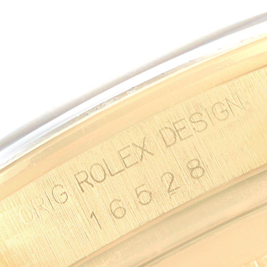 The image shows an engraving of the original design number inside the casing of the Rolex Daytona 16528 Men's Yellow Gold Black Dial 16528 Men's Yellow Gold Black Dial watch.