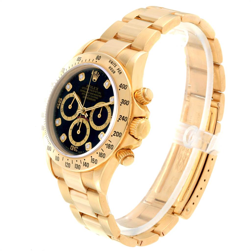 This Rolex Daytona 16528 Men's Yellow Gold Black Dial 16528 Men's Yellow Gold Black Dial watch is shown from a side angle, highlighting its gold bracelet, dial, and chronograph pushers.