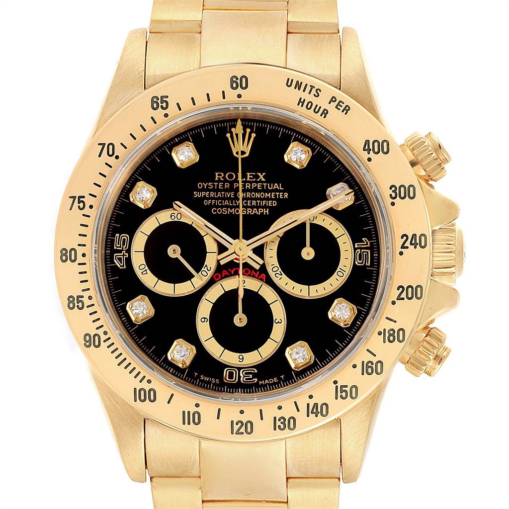 The image shows a frontal view of a Rolex Daytona 16528 Men's Yellow Gold Black Dial 16528 Men's Yellow Gold Black Dial watch, highlighting its gold case, black dial, and chronograph functions.