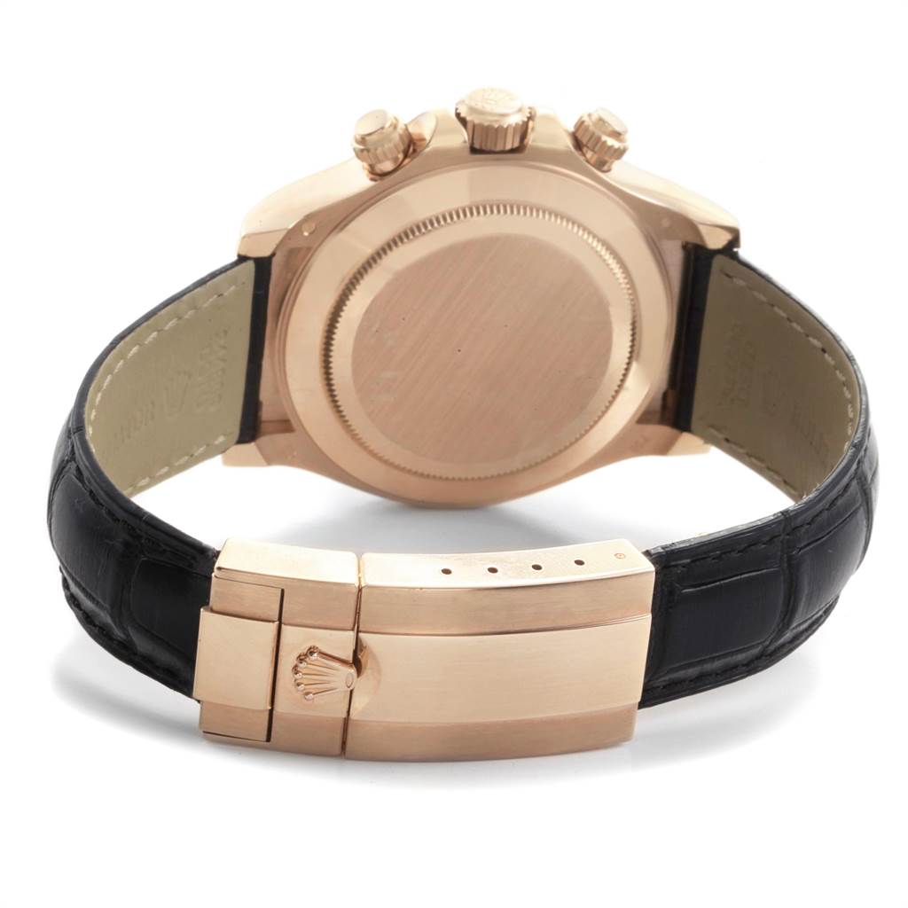 This image shows the back case and clasp of a Rolex Daytona 116515LN Men's Rose Gold Silver Dial 116515LN Men's Rose Gold Silver Dial watch, highlighting its leather strap and metal closure.