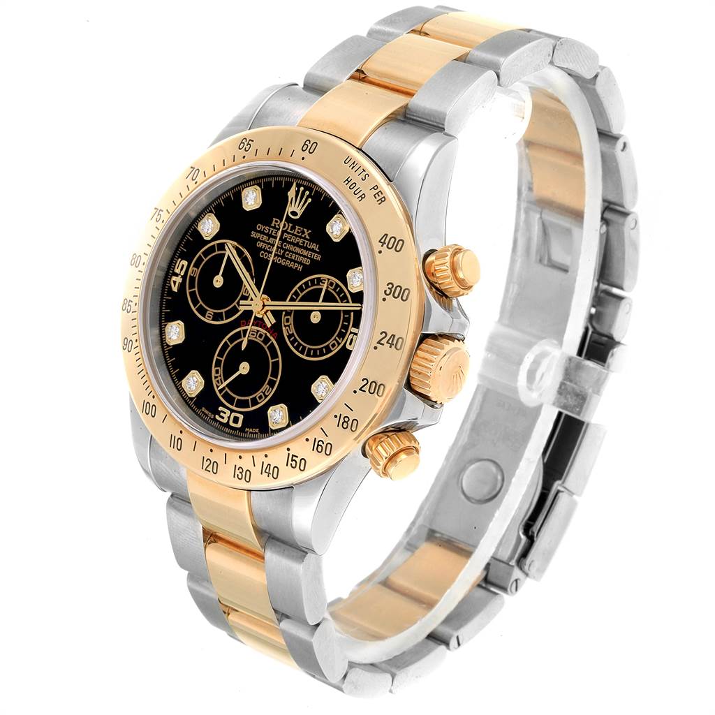 The image shows a Rolex Daytona 116523 Men
s Steel and Gold (two tone) Black Dial 116523 Men
s Steel and Gold (two tone) Black Dial watch at an oblique angle, highlighting its bezel, dial, and bracelet with gold and silver tones.