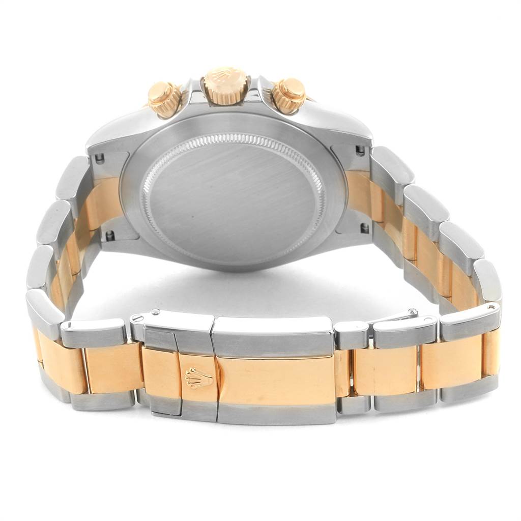 The image shows the back view of a Rolex Daytona 116523 Men
s Steel and Gold (two tone) Black Dial 116523 Men
s Steel and Gold (two tone) Black Dial watch, highlighting the clasp, bracelet, case back, and crown.