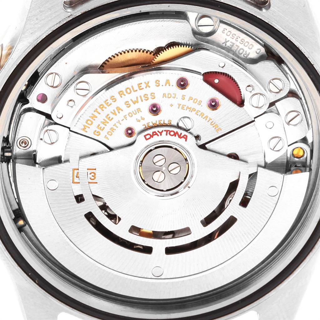 This image shows the movement
s detailed mechanics and engraving of the Rolex Daytona 116523 Men
s Steel and Gold (two tone) Black Dial 116523 Men
s Steel and Gold (two tone) Black Dial model from a close-up, back angle.