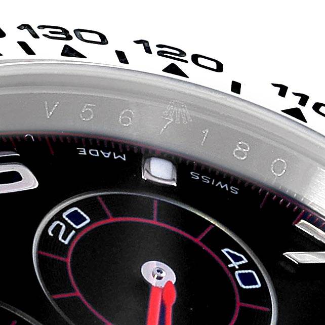 This image shows a close-up of the bezel and dial of a Rolex Daytona 116509 Men's White Gold Black Dial 116509 Men's White Gold Black Dial watch, featuring the tachymeter scale and part of the subdial.