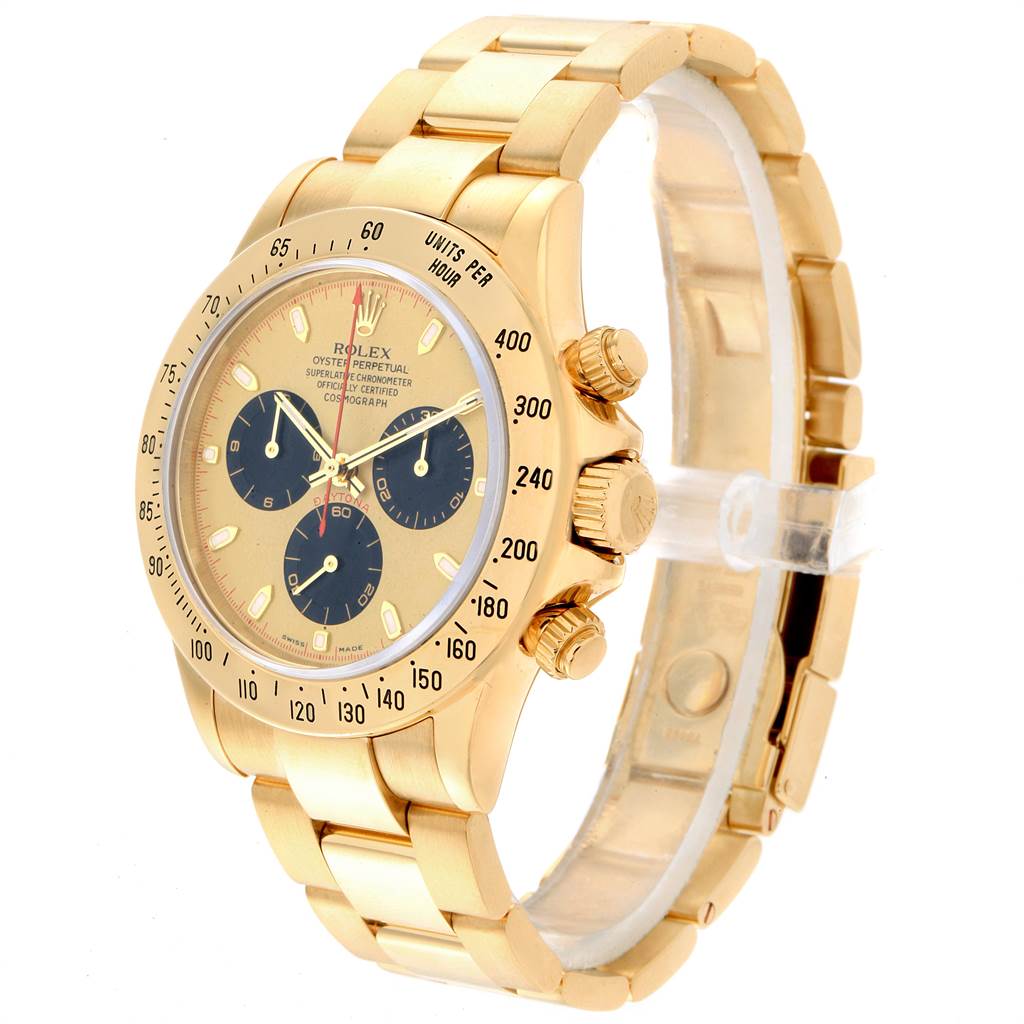 This image shows a gold Rolex Daytona 116528 Men's Yellow Gold Champagne Dial 116528 Men's Yellow Gold Champagne Dial watch at an angle revealing its face, bezel, and bracelet.