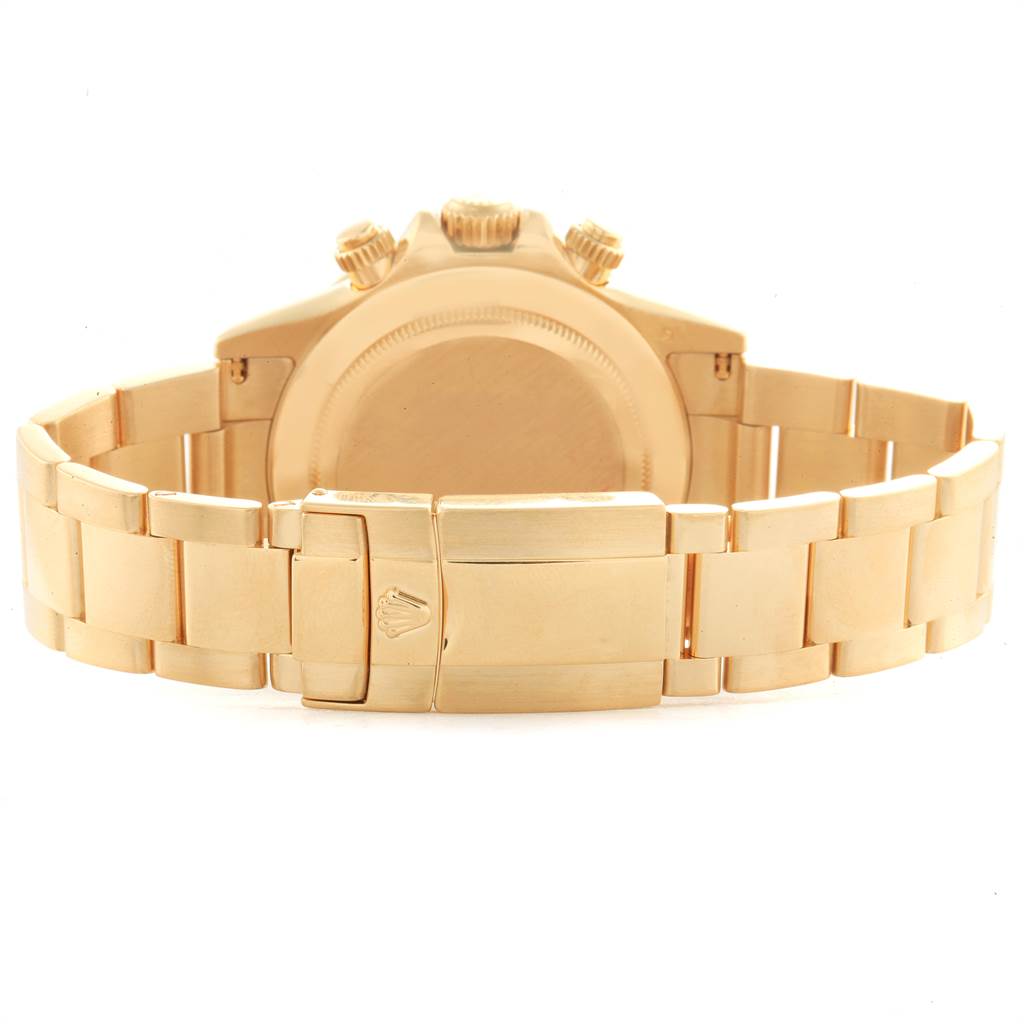 The image shows the back view of a Rolex Daytona 116528 Men's Yellow Gold Champagne Dial 116528 Men's Yellow Gold Champagne Dial watch, focusing on the clasp and bracelet.