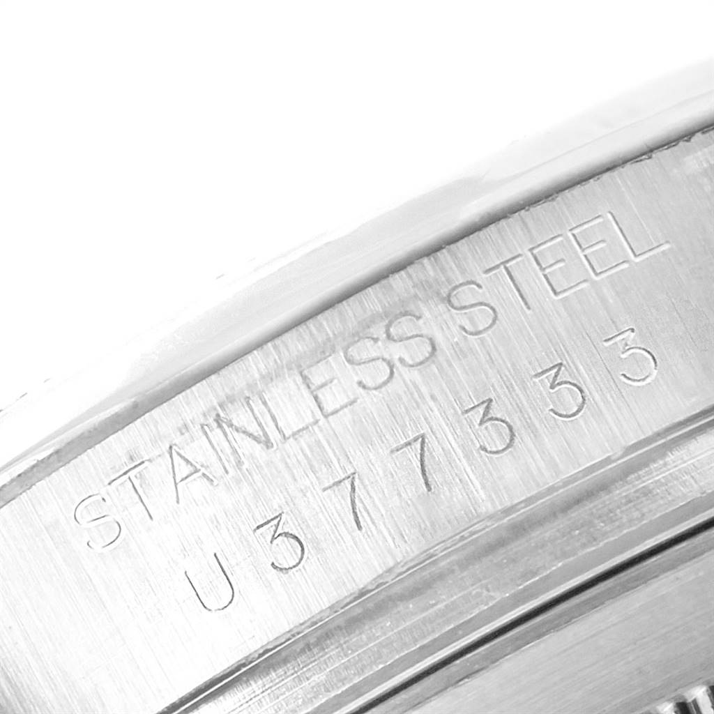 This image shows a close-up of the engraved serial number and "STAINLESS STEEL" marking on the Rolex Daytona 16520 Men's Stainless Steel Black Dial 16520 Men's Stainless Steel Black Dial watch case.
