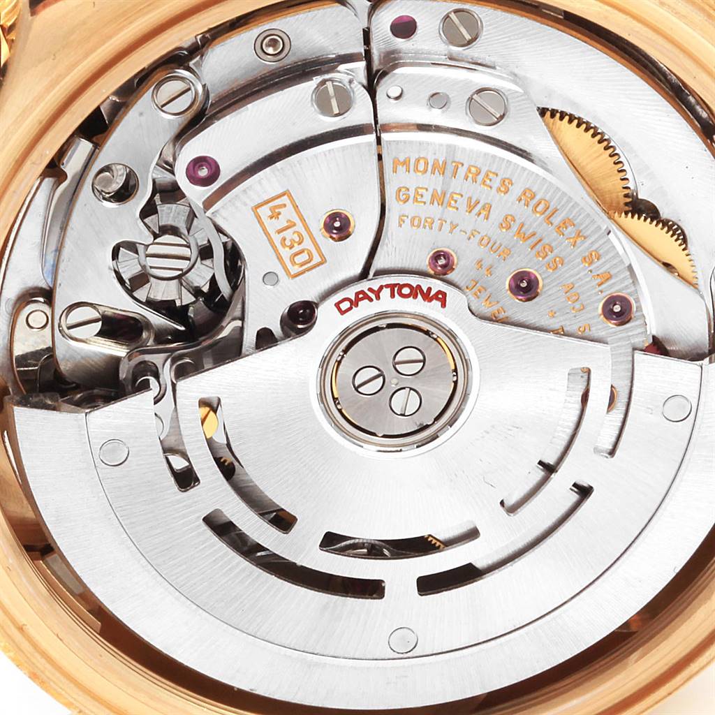 The image shows the intricate inner mechanism of a Rolex Daytona 116528 Men's Yellow Gold Black Dial 116528 Men's Yellow Gold Black Dial watch, viewed from the back.