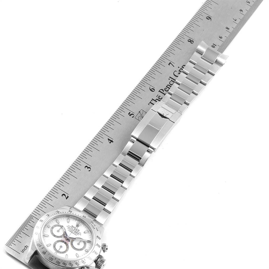 This image shows a Rolex Daytona 116520 Men's Stainless Steel White Dial 116520 Men's Stainless Steel White Dial watch from an overhead angle featuring the face, bracelet, and clasp.