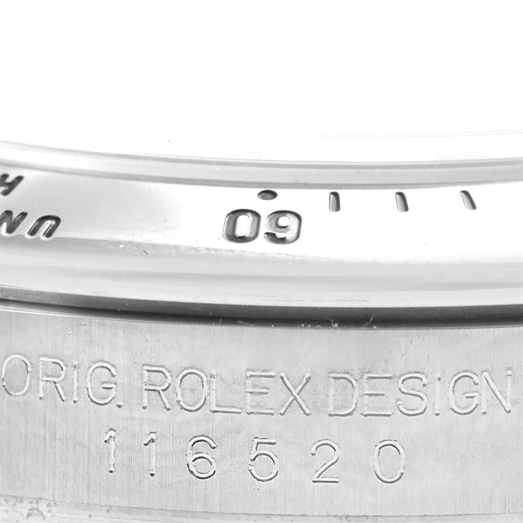 This image shows a close-up of the bezel and model number inscription on a Rolex Daytona 116520 Men's Stainless Steel Black Dial 116520 Men's Stainless Steel Black Dial watch.