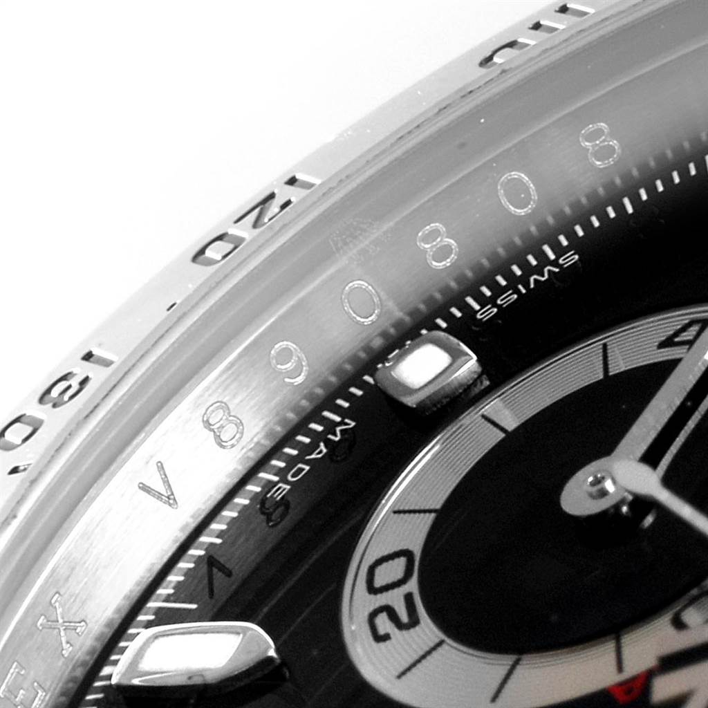 The image shows a close-up of the dial and bezel of a Rolex Daytona 116520 Men's Stainless Steel Black Dial 116520 Men's Stainless Steel Black Dial watch, focusing on the tachymeter scale and part of the subdial.