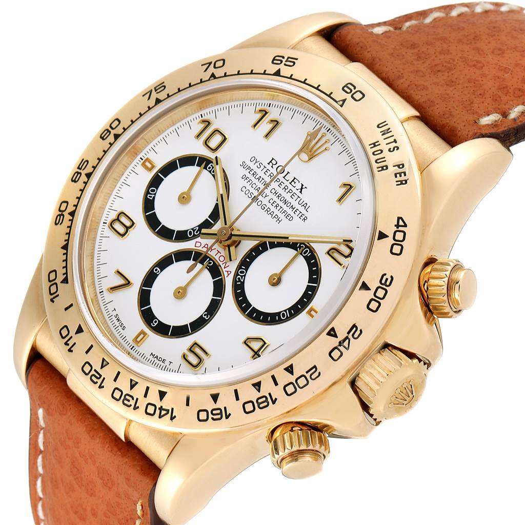 This image shows a close-up, angled view of the Rolex Daytona 16518 Men's Yellow Gold White Dial 16518 Men's Yellow Gold White Dial watch, highlighting the dial, bezel, and leather strap.