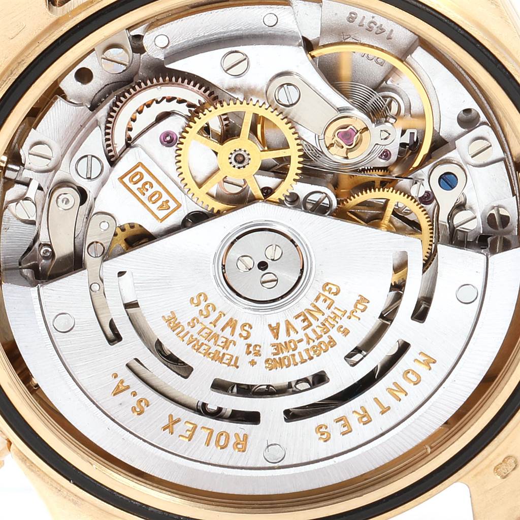 This image shows a close-up of the intricate internal mechanism of a Rolex Daytona 16518 Men's Yellow Gold White Dial 16518 Men's Yellow Gold White Dial watch.
