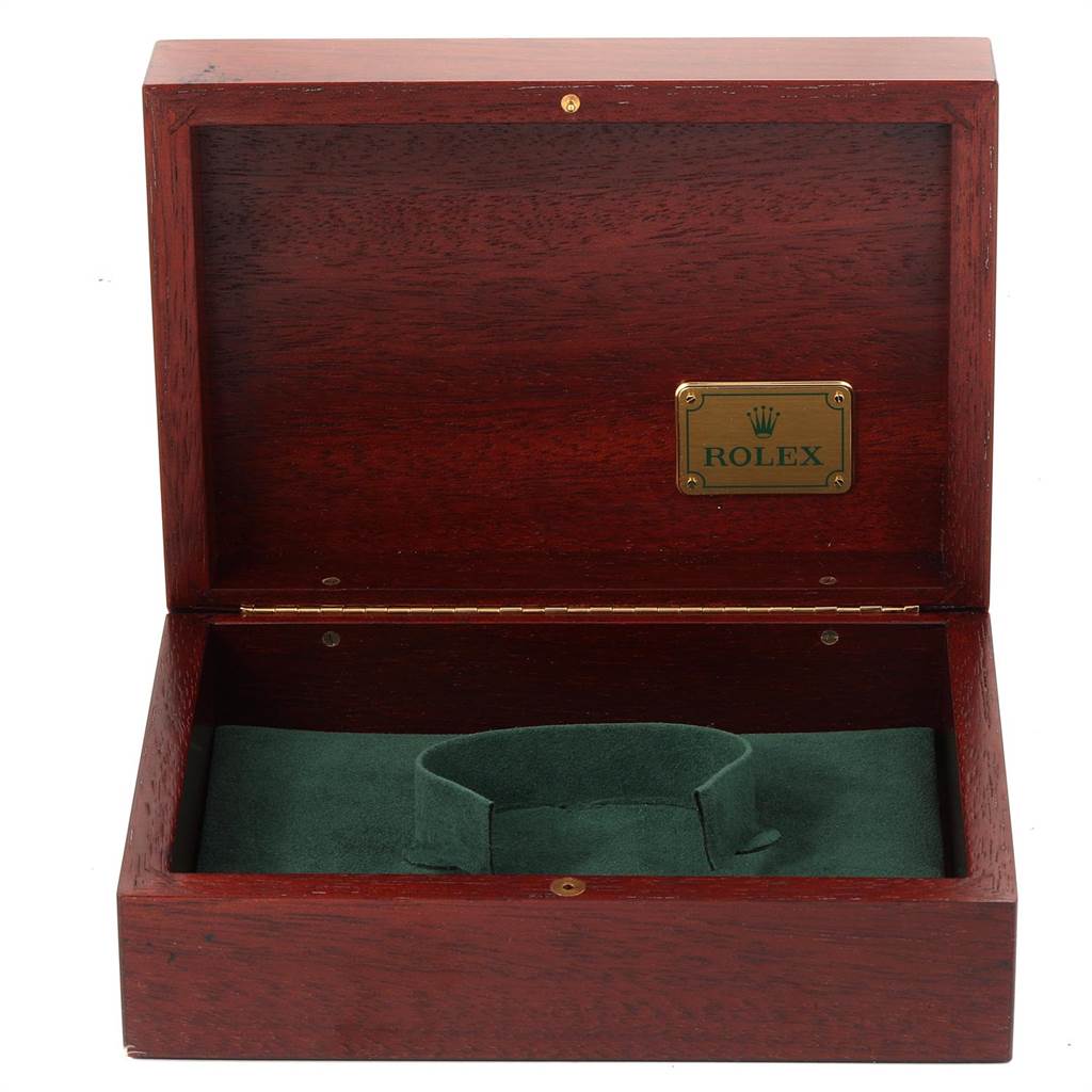 This image shows an open wooden Rolex Daytona 16518 Men's Yellow Gold White Dial 16518 Men's Yellow Gold White Dial watch box with a green interior cushion and a Rolex plaque inside the lid.
