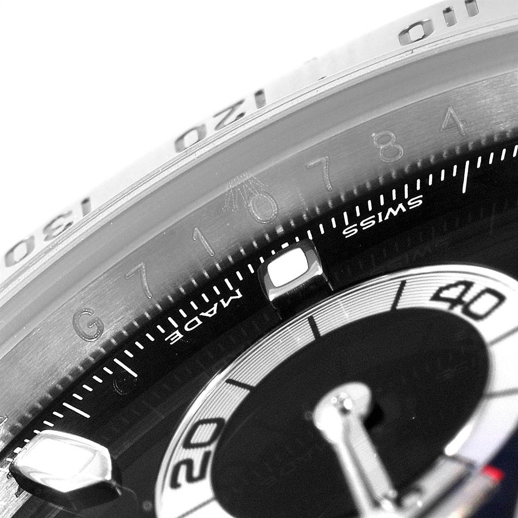 This close-up angle of the Rolex Daytona 116520 Men's Stainless Steel Black Dial 116520 Men's Stainless Steel Black Dial shows the detailed markings on the dial and bezel.