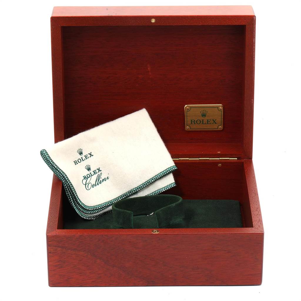 The image shows a Rolex Daytona 116523 Men's Steel and Gold (two tone) Grey Dial 116523 Men's Steel and Gold (two tone) Grey Dial watch box with a cloth and a cushion.