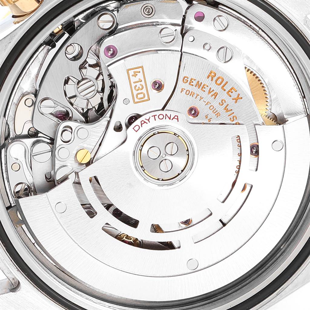 The image shows the intricate movement mechanism and internal parts of a Rolex Daytona 116523 Men's Steel and Gold (two tone) Grey Dial 116523 Men's Steel and Gold (two tone) Grey Dial watch.
