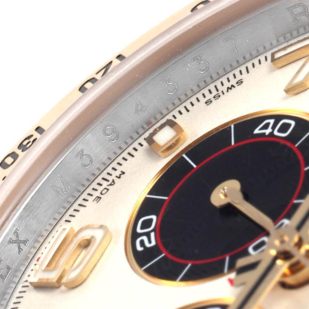 The image shows a close-up angle of the dial and part of the bezel of a Rolex Daytona 116523 Men's Steel and Gold (two tone) White Dial 116523 Men's Steel and Gold (two tone) White Dial watch.
