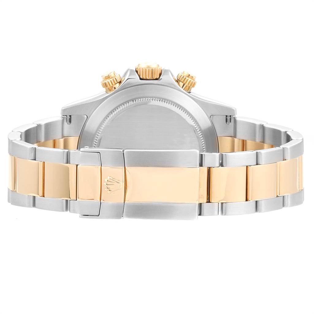 The image shows the back view of a Rolex Daytona 116523 Men's Steel and Gold (two tone) White Dial 116523 Men's Steel and Gold (two tone) White Dial watch, highlighting its clasp, bracelet links, and crown.