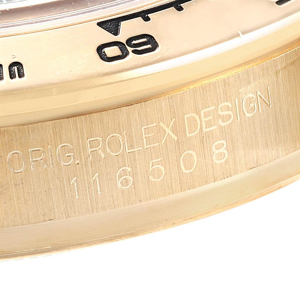 This is a close-up shot of the bezel and engraved reference number on a Rolex Daytona 116508 Men's Yellow Gold Green Dial 116508 Men's Yellow Gold Green Dial watch.