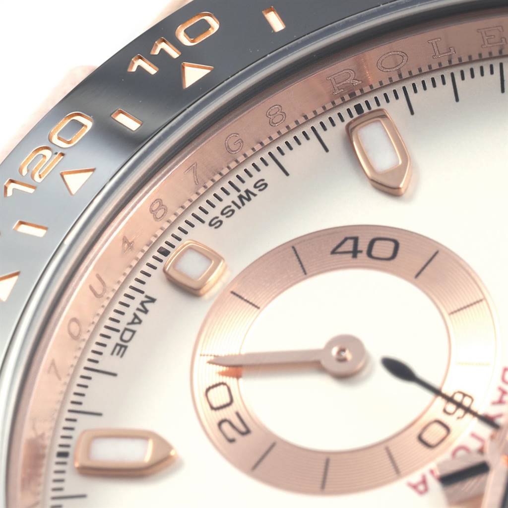 The close-up image of the Rolex Daytona 116515LN Men's Rose Gold Silver Dial 116515LN Men's Rose Gold Silver Dial watch shows part of the bezel, hour markers, and sub-dial.