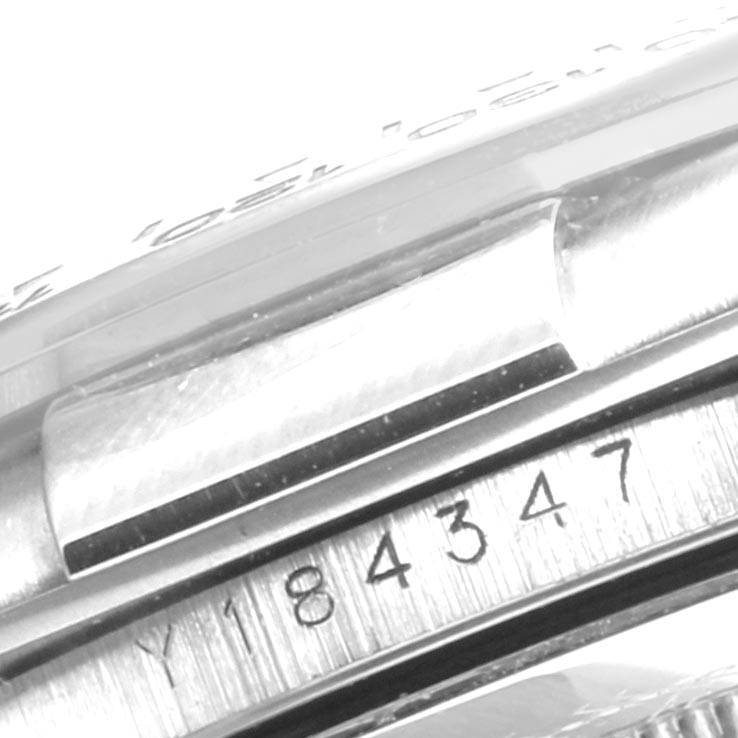 The image shows a close-up of the side and bezel engraving of a Rolex Daytona 116519 Men's White Gold Silver Dial 116519 Men's White Gold Silver Dial watch.