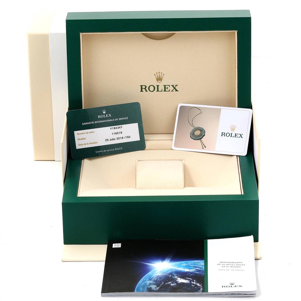 The image shows the open box of a Rolex Daytona 116519 Men's White Gold Silver Dial 116519 Men's White Gold Silver Dial, including warranty cards and booklets.