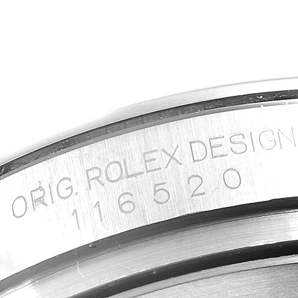 The image shows the serial number engraving on the side of the case of a Rolex Daytona 116520 Men's Stainless Steel Black Dial 116520 Men's Stainless Steel Black Dial model watch.