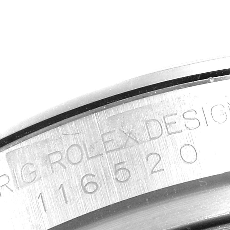 This image shows a close-up of the engraving on the caseback of a Rolex Daytona 116520 Men's Stainless Steel Black Dial 116520 Men's Stainless Steel Black Dial watch.
