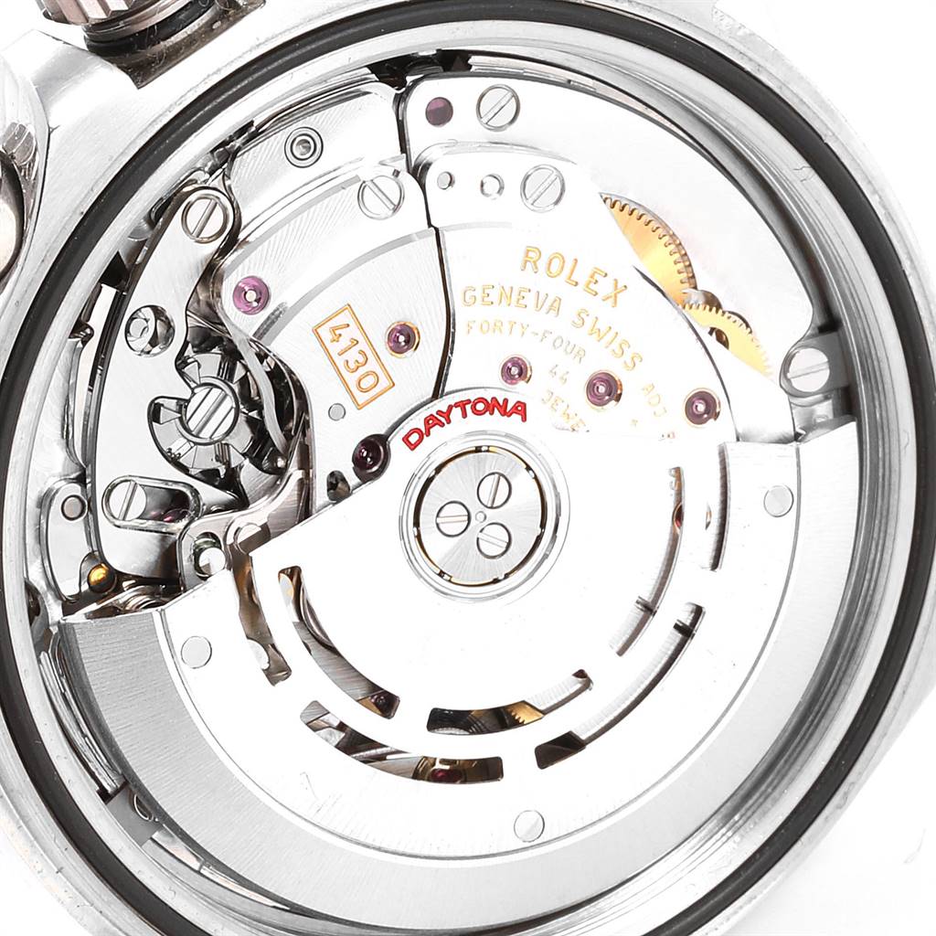 The image shows a close-up view of the movement mechanism of a Rolex Daytona 116520 Men's Stainless Steel Black Dial 116520 Men's Stainless Steel Black Dial watch.