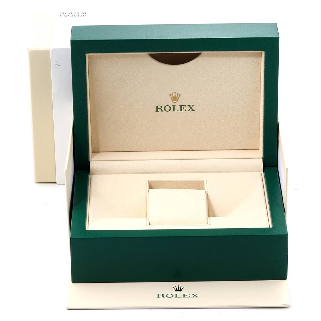 The image shows the open presentation box for a Rolex Daytona 116520 Men's Stainless Steel Black Dial 116520 Men's Stainless Steel Black Dial watch, displaying its interior compartments and logo.