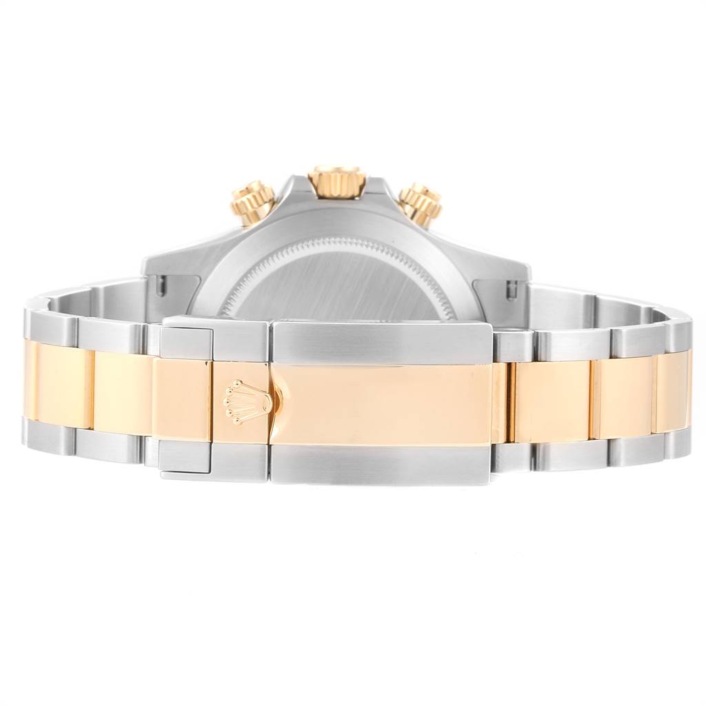 The image shows the clasp and caseback of a Rolex Daytona 116503 Men's Steel and Gold (two tone) Black Dial 116503 Men's Steel and Gold (two tone) Black Dial watch from the rear angle.