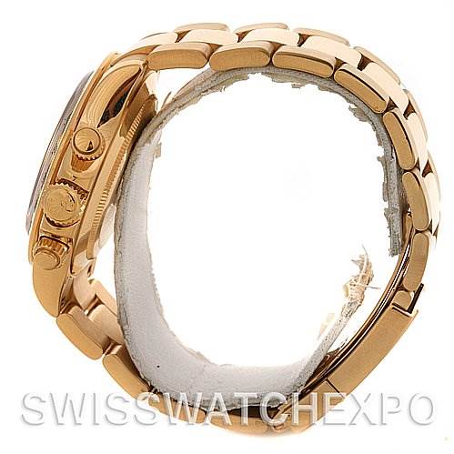 This image shows a Rolex Daytona 116528 Men's Yellow Gold Black Dial 116528 Men's Yellow Gold Black Dial watch from a side angle, highlighting the bracelet, crown, and pushers.