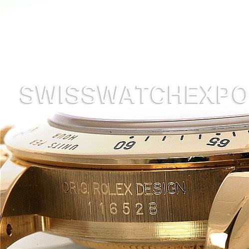 This image shows a close-up side angle of the bezel and case of a Rolex Daytona 116528 Men's Yellow Gold Black Dial 116528 Men's Yellow Gold Black Dial watch with engraved markings.