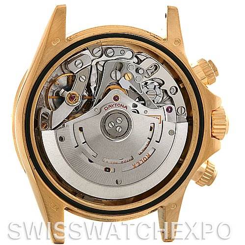 This image shows the back of a Rolex Daytona 116528 Men's Yellow Gold Black Dial 116528 Men's Yellow Gold Black Dial watch, revealing its movement and internal mechanics.