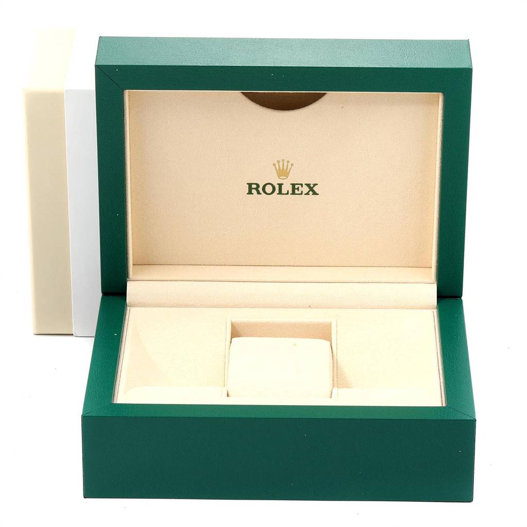 This image shows an open Rolex Daytona 116500 Men's Stainless Steel Black Dial 116500 Men's Stainless Steel Black Dial watch box with cream-colored interior and green exterior.