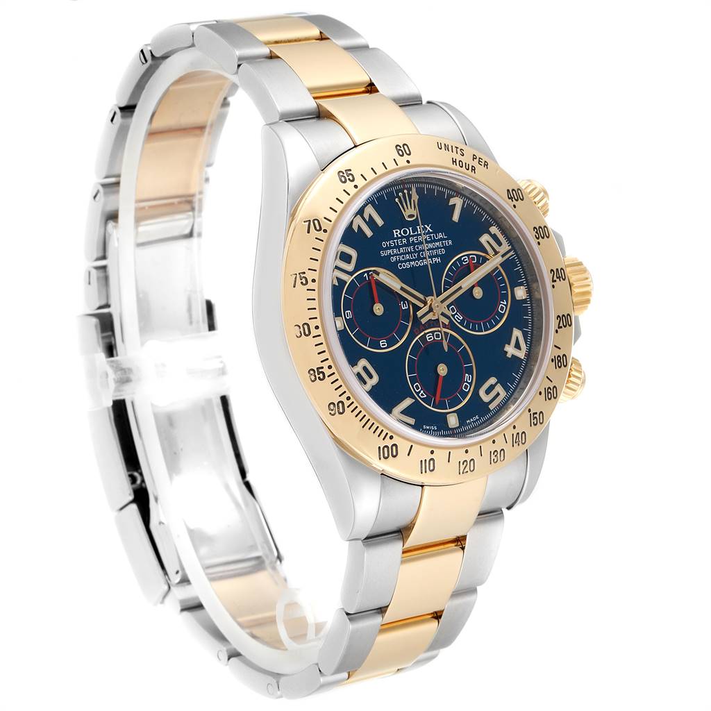 The image shows a Rolex Daytona 116523 Men's Steel and Gold (two tone) Blue Dial 116523 Men's Steel and Gold (two tone) Blue Dial watch at a slight angle, highlighting its face, bezel, and two-tone bracelet.