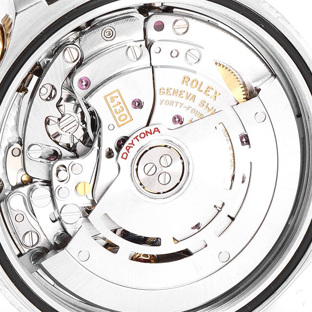 This image shows the internal workings of a Rolex Daytona 116523 Men's Steel and Gold (two tone) Blue Dial 116523 Men's Steel and Gold (two tone) Blue Dial watch, highlighting its mechanics from a close-up angle.