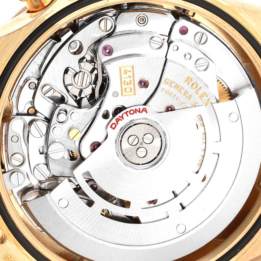 This image shows the intricate internal mechanism of a Rolex Daytona 116528 Men's Yellow Gold Black Dial 116528 Men's Yellow Gold Black Dial watch from a top-down angle.