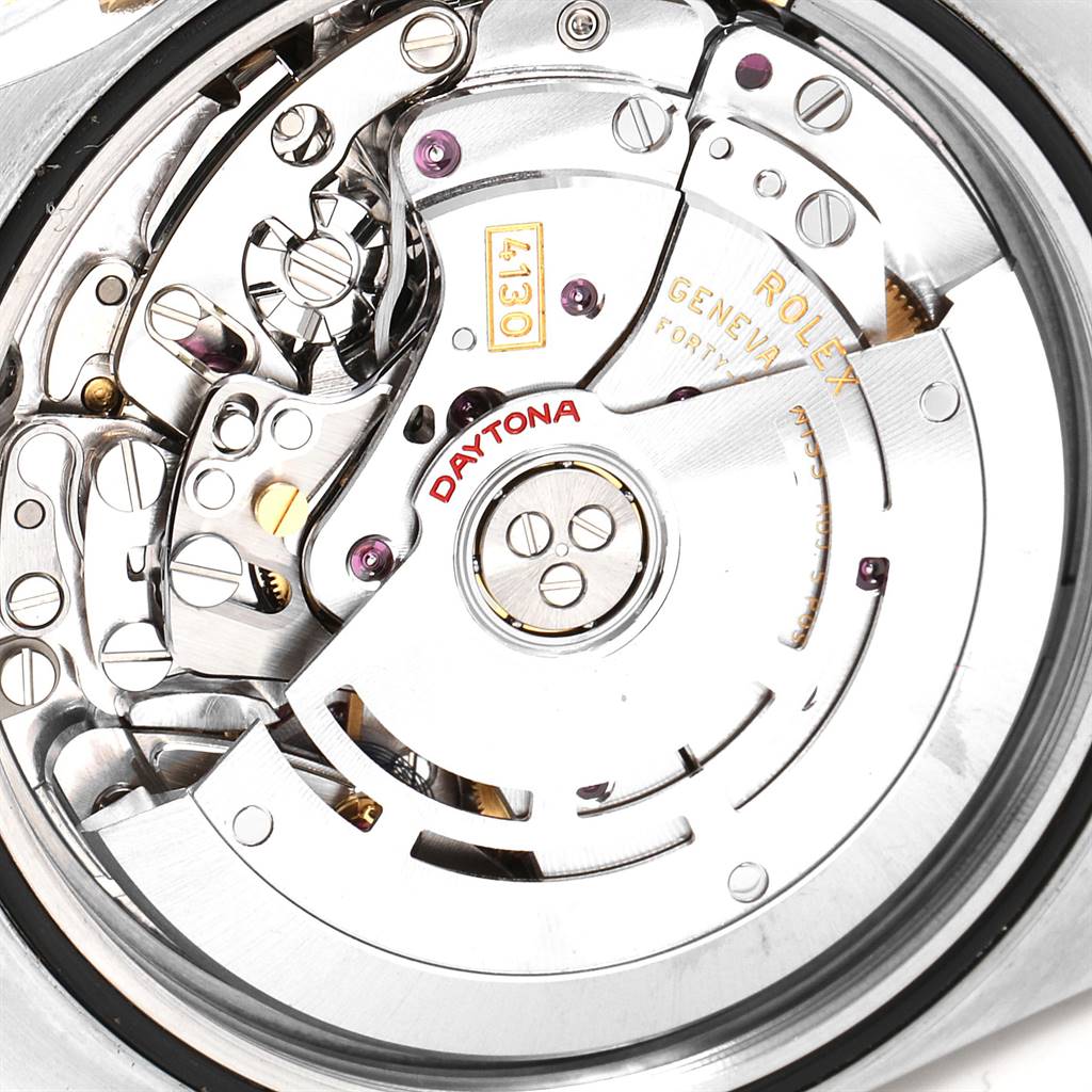 The image shows an intricate close-up of the inner mechanical parts of a Rolex Daytona 116523 Men's Steel and Gold (two tone) Black Dial 116523 Men's Steel and Gold (two tone) Black Dial watch.